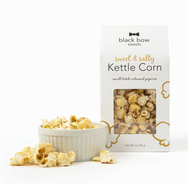 A package of Black Bow Sweets sweet and salty kettle corn next to a small white bowl filled with kettle corn.