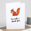 A white gift enclosure card picturing a squirrel holding a nut that says "I'm nuts about you"