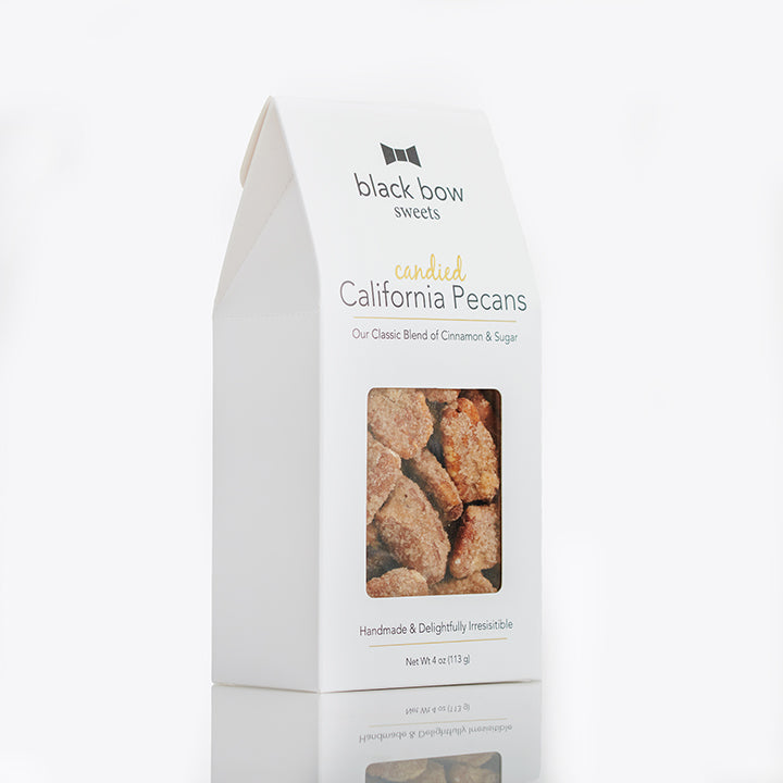 A package of Black Bow Sweets candied California cinnamon and sugar coated pecans.