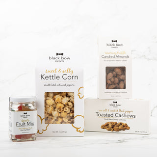 Group of Black Bow Sweets products including gummy bears, kettle corn and candied nuts.