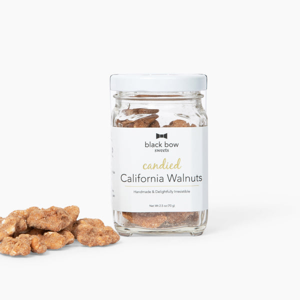 A jar of Black Bow Sweets candied California cinnamon and sugar coated walnuts.