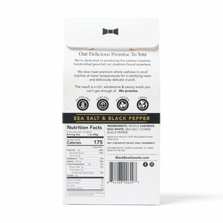 Back view of a white standup box for Black Bow Sweets Sea Salt & Black Pepper cashews, showing printed text, nutrition facts, and a barcode on a plain white background.